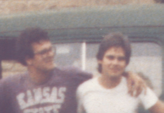 Richard Predmore and Mark Travis, founders of Allen-Lee Screen Printing posed together in a film photograph.
